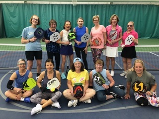 Pickleball players posing for a group photo.